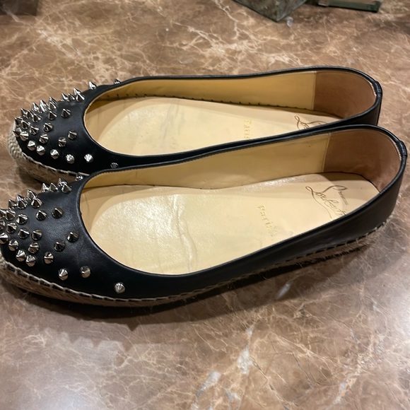 Christian Louboutin black leather espadrille flats with studs.